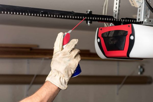 Applying oil to a chain of a garage door opener